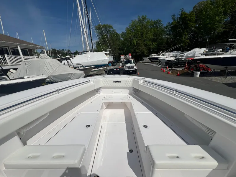 Slide: The Image of 2024 Invincible 39 Open Fisherman boat at marina, bow view. - 5