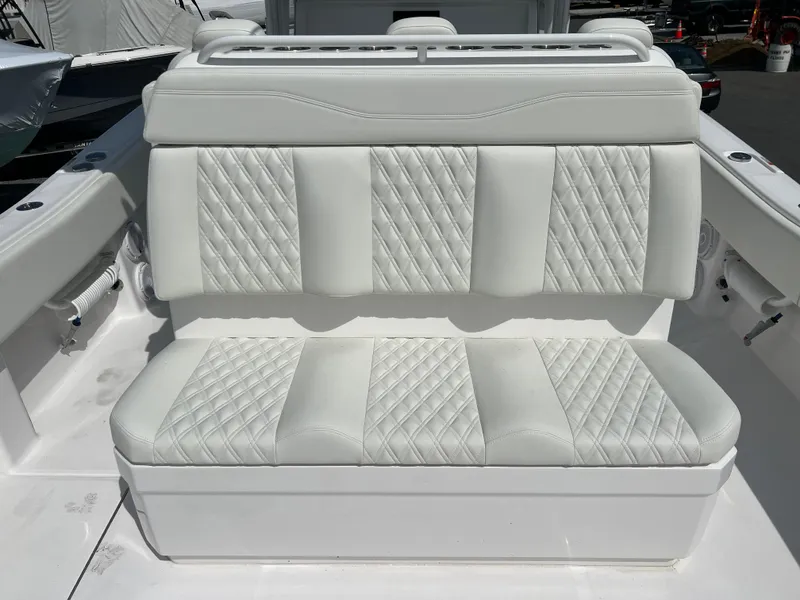Slide: The Image of 2024 Invincible 39 Open Fisherman white cushioned seating. - 9