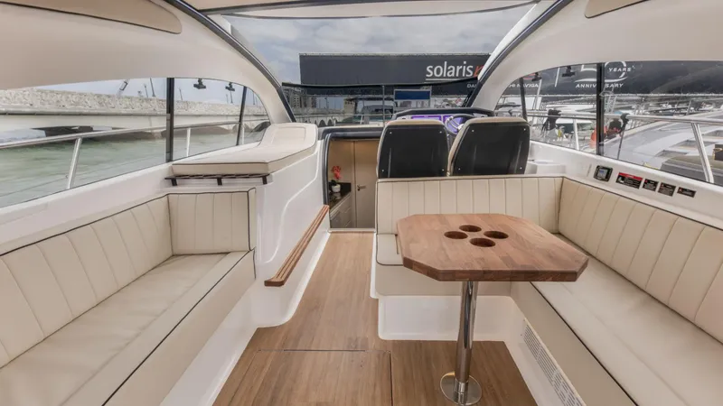 Slide: The Image of Luxurious interior of 2025 Hanover 415 yacht with elegant seating and wooden table. - 18