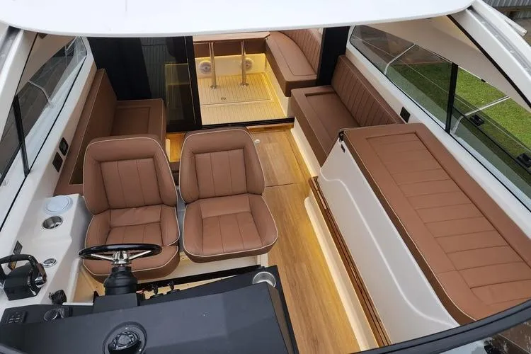 Slide: The Image of Luxurious 2026 Hanover 415 Inboard boat interior with brown leather seating and modern design. - 19