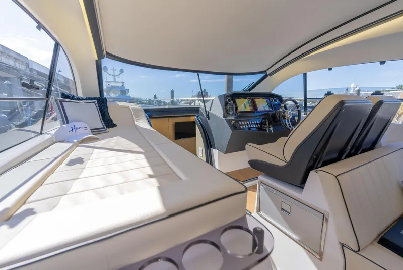 Slide: The Image of Luxurious interior of 2025 Hanover 415 yacht with modern helm and comfortable seating. - 20