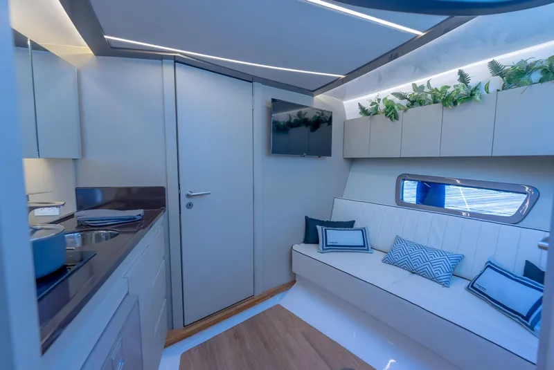 Slide: The Image of Luxurious interior of 2025 Hanover 415 yacht with modern seating and elegant decor. - 24