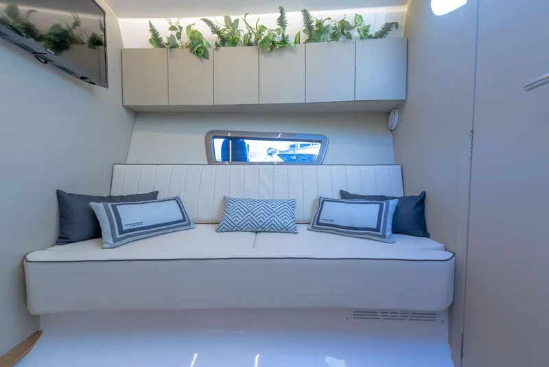 Slide: The Image of Luxurious interior of 2025 Hanover 415 yacht with modern seating and decorative plants. - 29