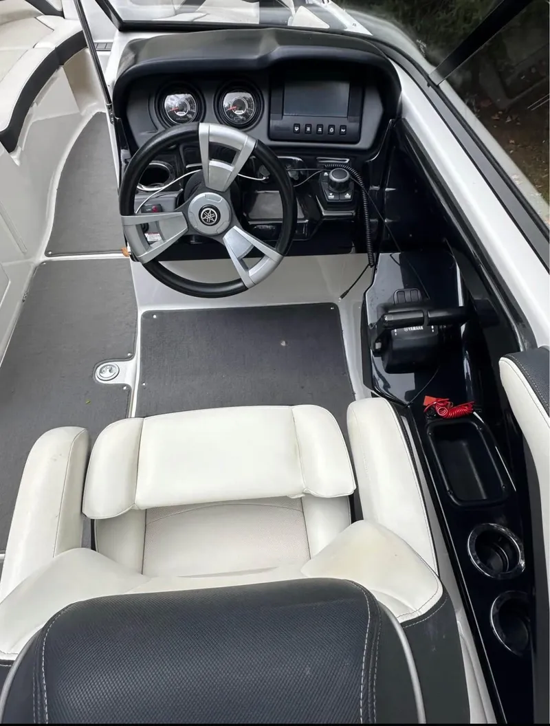 Slide: The Image of 2016 Yamaha Boats AR240 cockpit with steering wheel and control panel. - 4