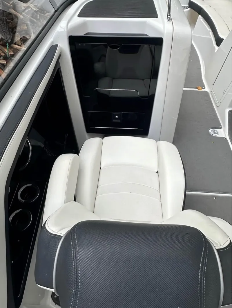Slide: The Image of 2016 Yamaha AR240 boat interior with white and black seating. - 6