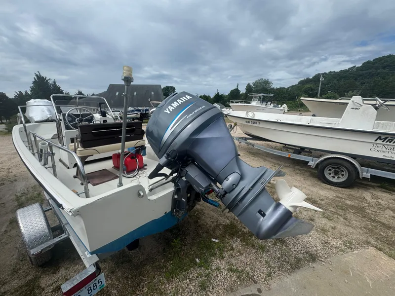 Slide: The Image of 1984 Boston Whaler 170 Montauk with Yamaha outboard motor on a trailer. - 5