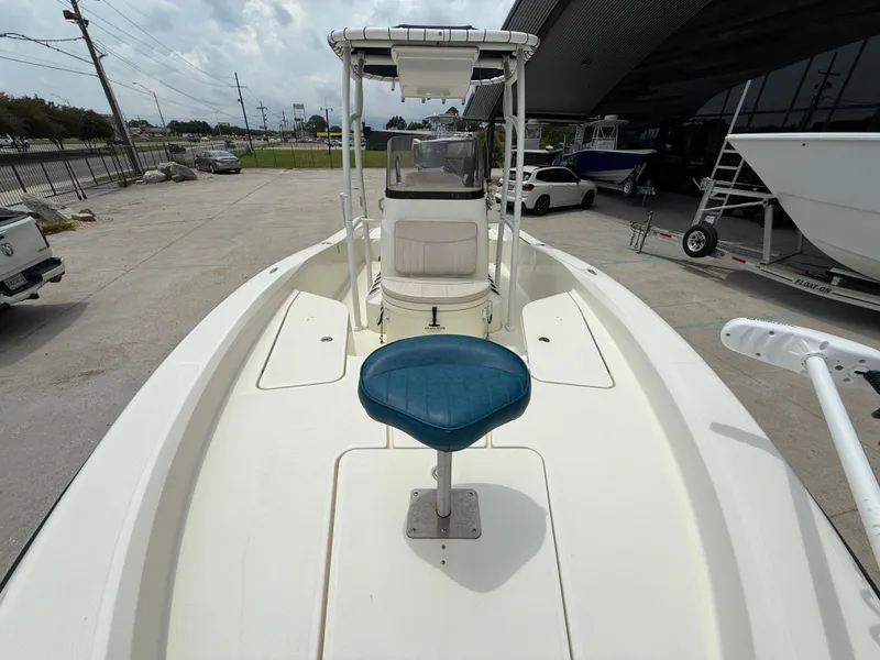 Slide: The Image of 2012 Hydra-Sports 23 Bay Bolt boat with blue seat, docked outdoors. - 11