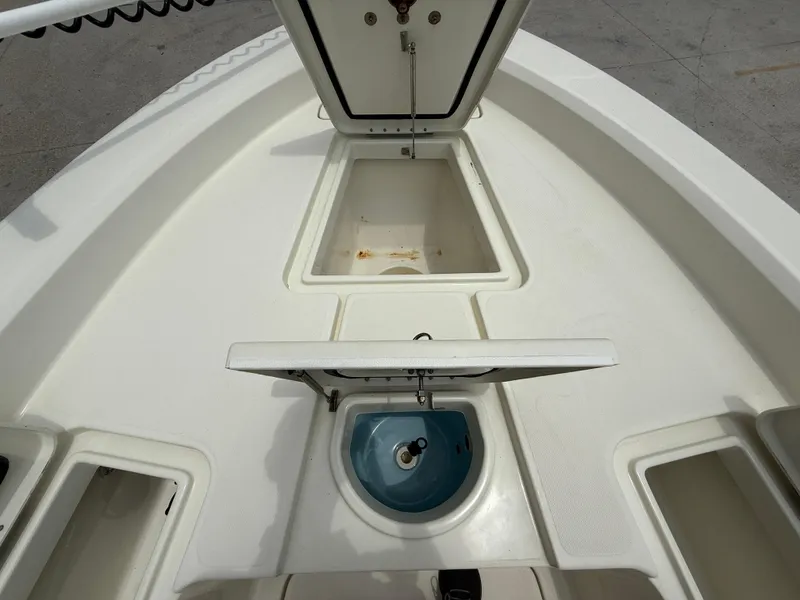 Slide: The Image of 2012 Hydra-Sports 23 Bay Bolt boat deck with storage compartments open. - 13
