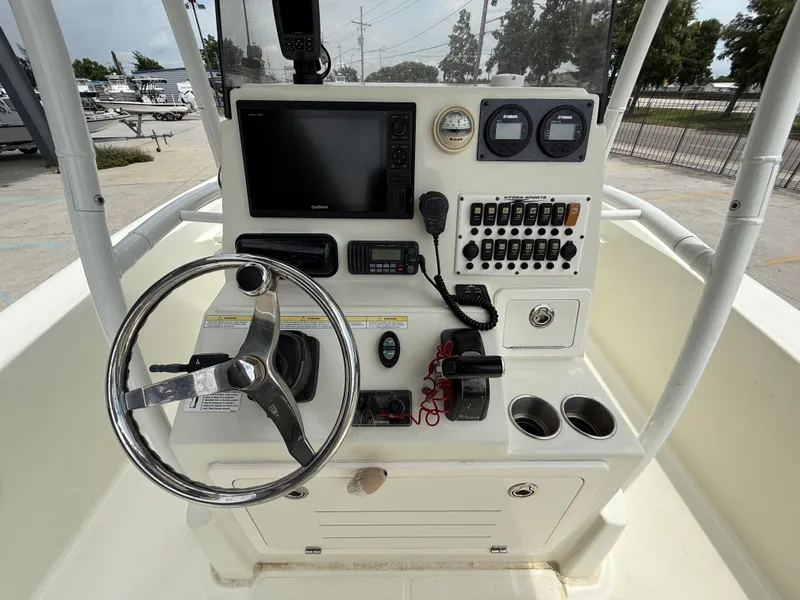 Slide: The Image of 2012 Hydra-Sports 23 Bay Bolt boat console with steering wheel and navigation controls. - 20