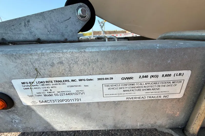 Slide: The Image of Label on Load Rite trailer showing specifications and compliance details. - 13