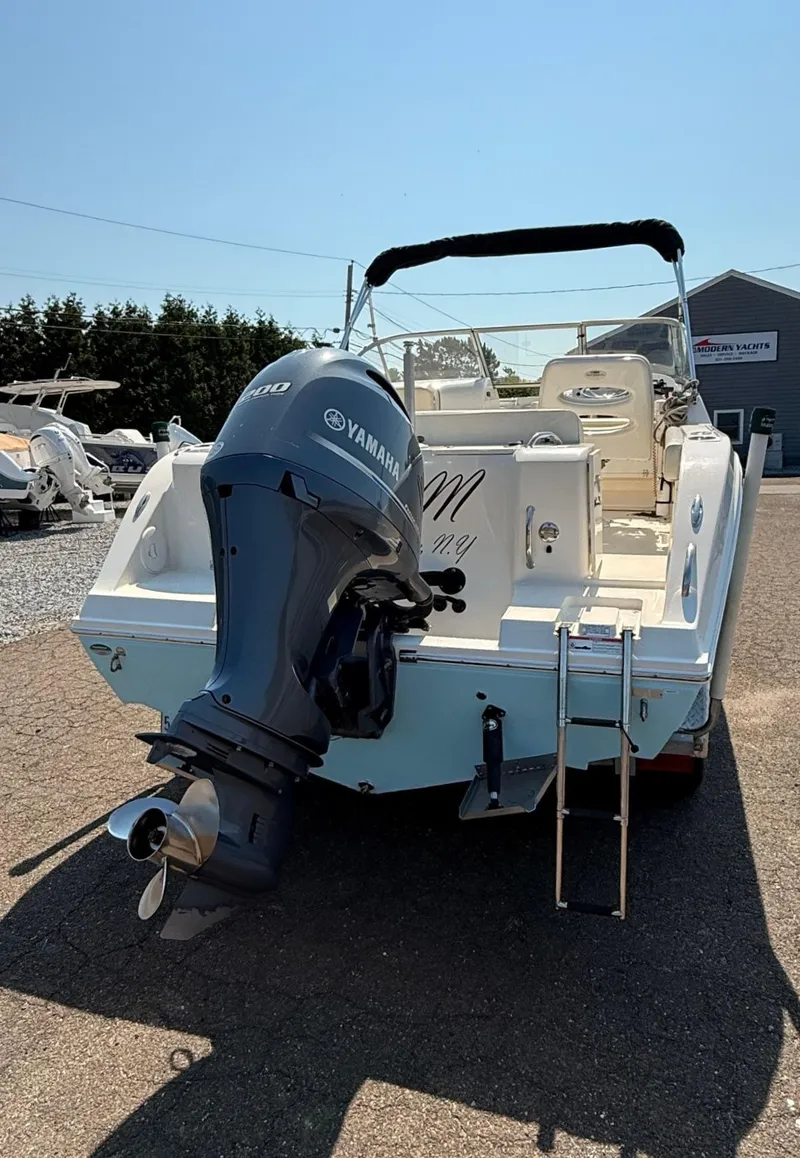 Slide: The Image of 2017 Cobia 220 Dual Console boat with Yamaha outboard motor, rear view. - 5
