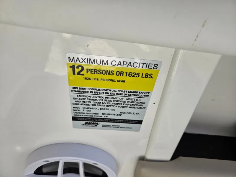 Slide: The Image of Capacity label on 2022 Chaparral 21 SSi boat, max 12 persons or 1625 lbs. - 16