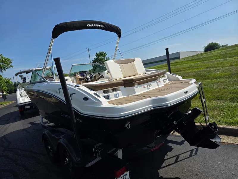 Slide: The Image of 2022 Chaparral 21 SSi boat on trailer, featuring sleek design and spacious seating. - 3