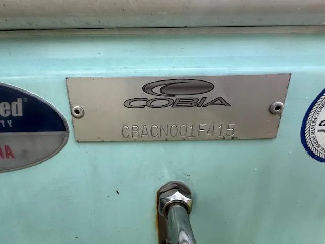Slide: The Image of 2015 Cobia 296 Center Console boat identification plate with serial number. - 10