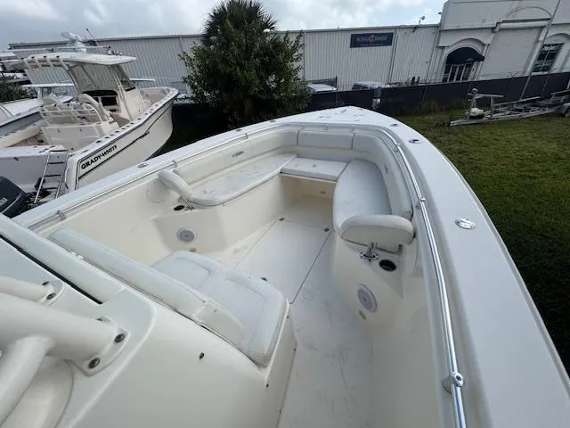 Slide: The Image of 2015 Cobia 296 Center Console boat with spacious seating and sleek design. - 28