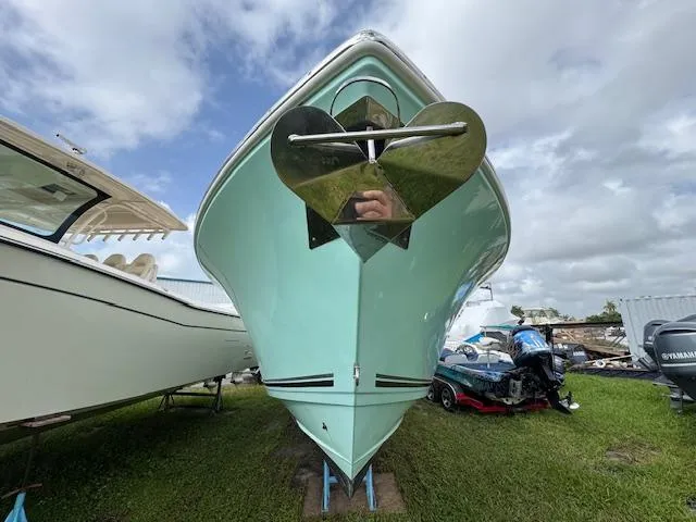 Slide: The Image of 2015 Cobia 296 Center Console boat on display, front view. - 3