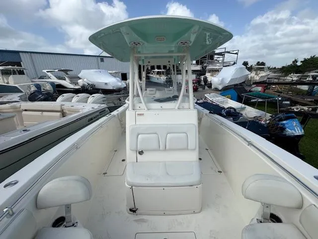 Slide: The Image of 2015 Cobia 296 Center Console boat with spacious seating and modern design. - 30