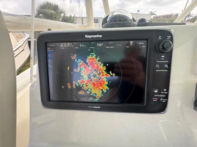 Slide: The Image of Raymarine display on 2015 Cobia 296 Center Console showing radar data. - 38