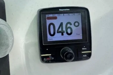 Slide: The Image of Raymarine navigation display showing 046 degrees on a 2015 Cobia 296 Center Console. - 40