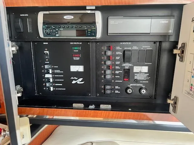 Slide: The Image of Electrical control panel of 2003 Sea Ray 290 Amberjack boat with stereo system. - 17