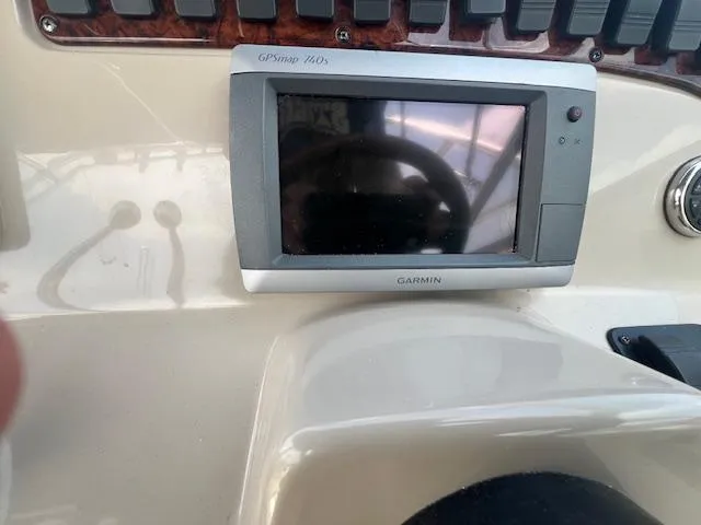 Slide: The Image of Garmin GPS device on 2003 Sea Ray 290 Amberjack boat dashboard. - 4
