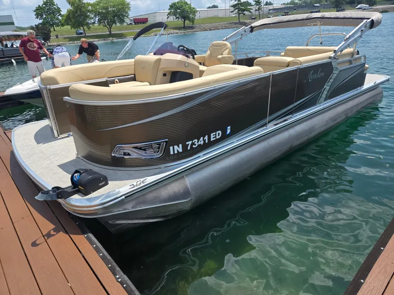 Slide: The Image of 2020 Avalon LSZ Cruise II pontoon boat docked on a sunny day. - 3