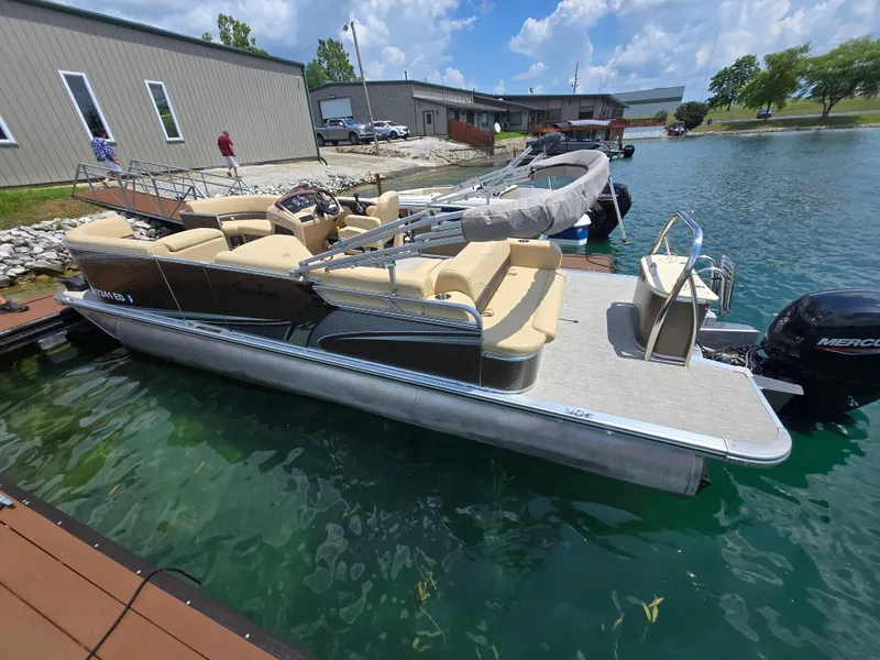 Slide: The Image of 2020 Avalon LSZ Cruise II pontoon boat docked on a sunny day. - 5