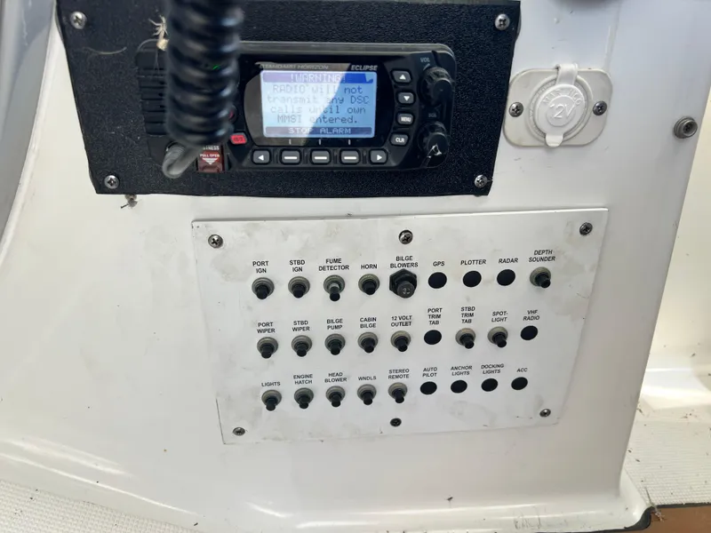 Slide: The Image of Control panel of a 2006 Formula 40 PC boat with switches and gauges. - 23
