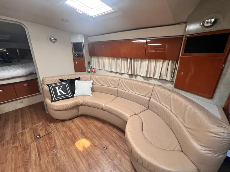 Slide: The Image of Luxurious 2006 Formula 40 PC yacht interior with leather seating, wooden table, and modern decor. - 27