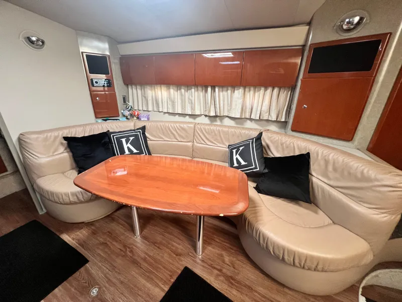Slide: The Image of Interior of 2006 Formula 40 PC yacht with modern furnishings and wooden flooring. - 29