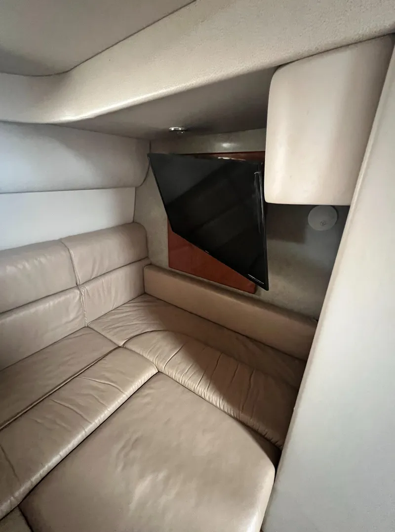 Slide: The Image of Interior of 2006 Formula 40 PC yacht with beige leather seating and window. - 41
