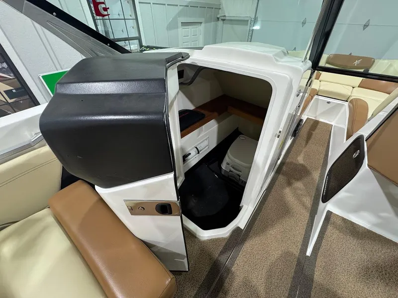 Slide: The Image of 2016 MasterCraft X26 boat interior with seating and storage area. - 20