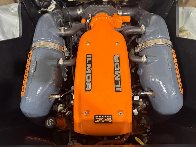 Slide: The Image of 2016 MasterCraft X26 Ilmor MV8 7.4 engine with orange and gray components. - 35