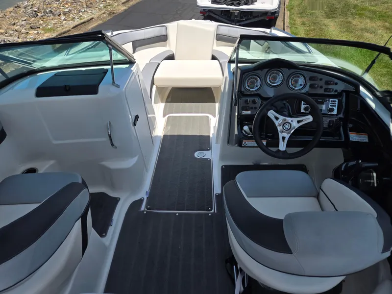 Slide: The Image of 2013 Yamaha Boats 212SS interior with steering wheel and seating. - 11