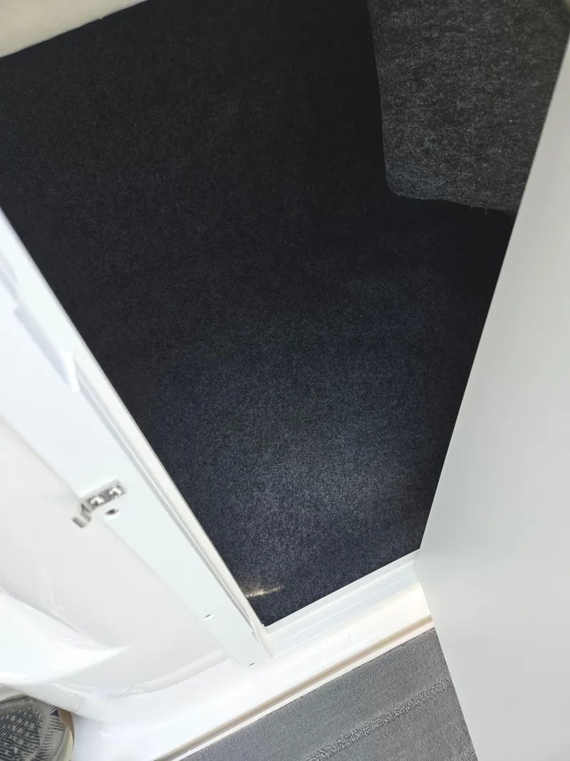 Slide: The Image of Interior storage compartment of a 2013 Yamaha Boats 212SS. - 14