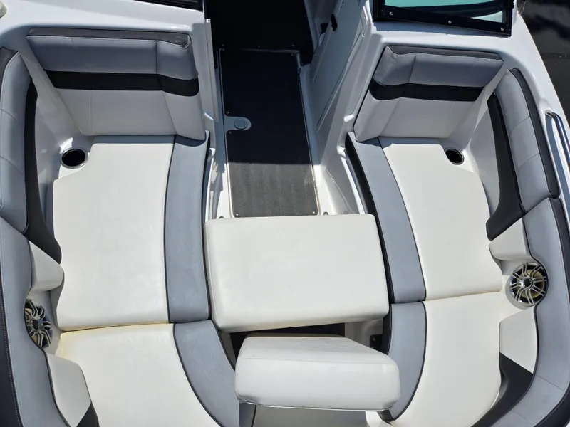 Slide: The Image of 2013 Yamaha Boats 212SS interior seating with gray and white upholstery. - 18