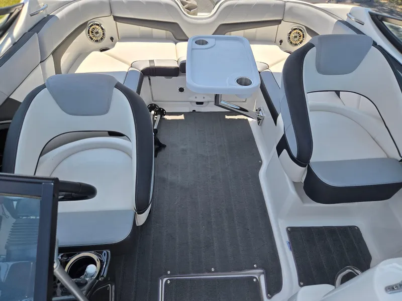 Slide: The Image of 2013 Yamaha Boats 212SS interior with seating and table setup. - 20