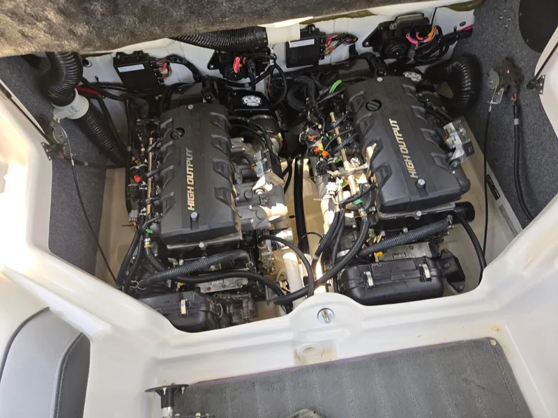 Slide: The Image of 2013 Yamaha Boats 212SS engine compartment with dual high output engines. - 22