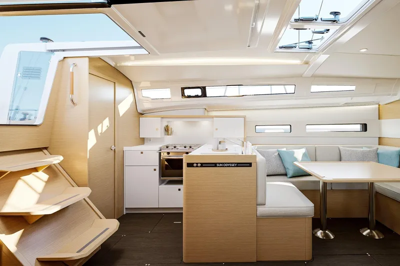 Slide: The Image of Modern interior of 2026 Jeanneau Sun Odyssey 415 yacht, featuring sleek design and comfortable seating. - 5