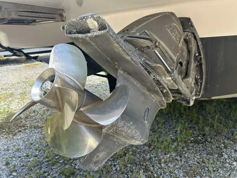 Slide: The Image of Close-up of a 2017 Regal 26 Express boat propeller on gravel surface. - 15