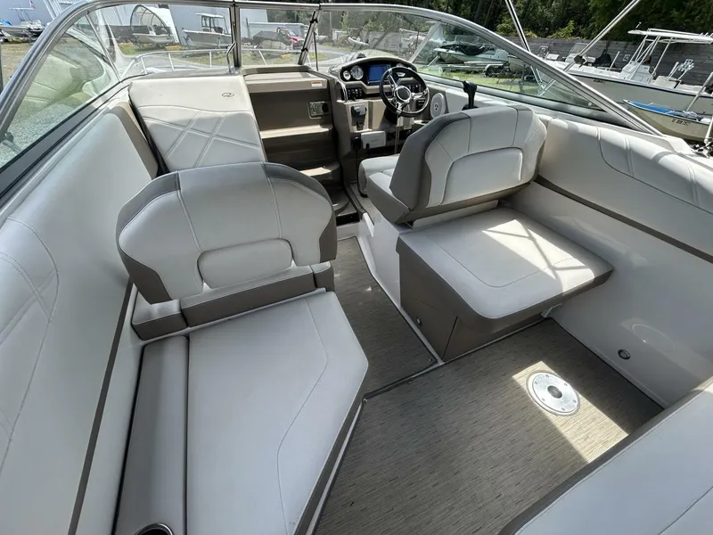 Slide: The Image of 2017 Regal 26 Express boat interior with plush seating and modern dashboard. - 17