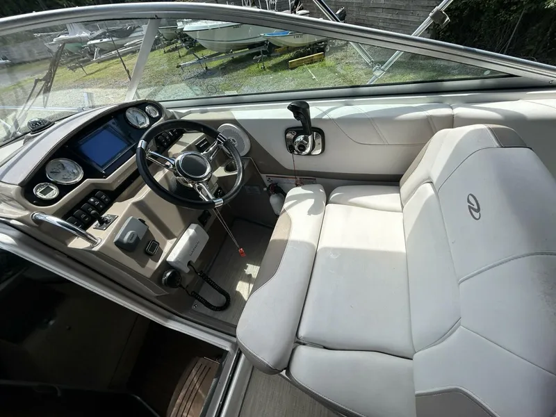 Slide: The Image of 2017 Regal 26 Express boat interior with steering wheel and dashboard controls. - 18
