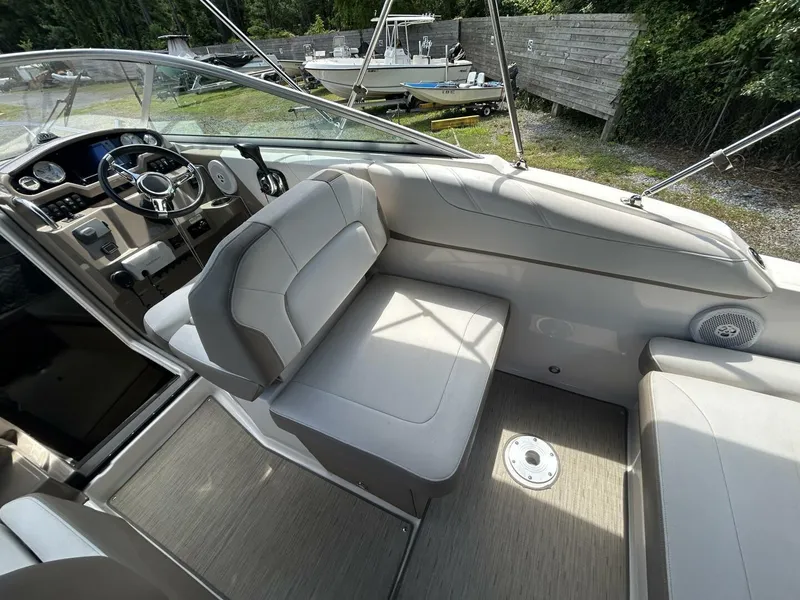 Slide: The Image of 2017 Regal 26 Express boat interior with steering wheel and seating area. - 19