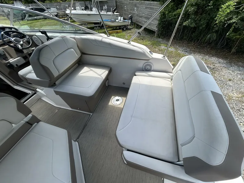 Slide: The Image of 2017 Regal 26 Express boat interior with cushioned seating and steering wheel. - 20