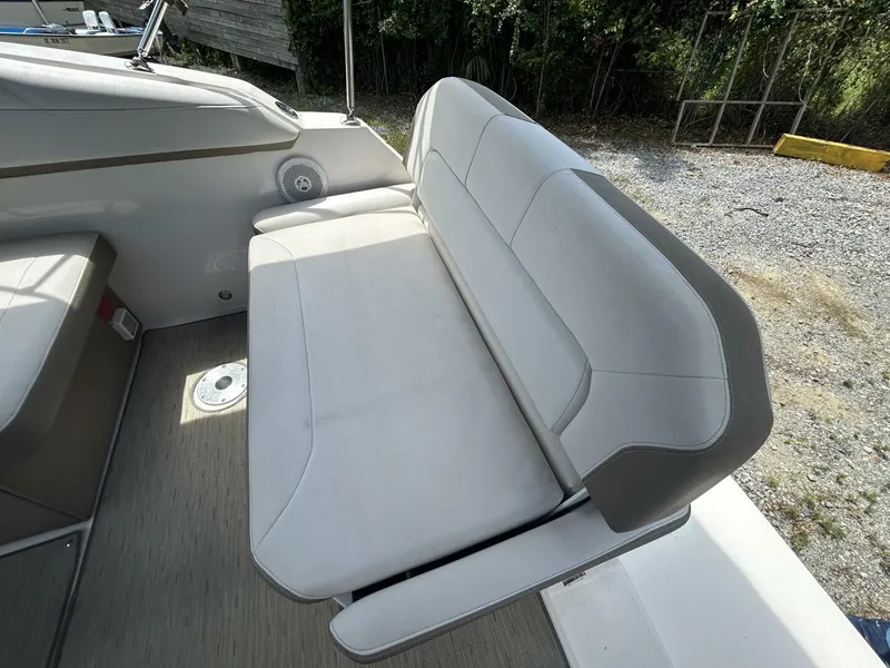 Slide: The Image of 2017 Regal 26 Express boat interior with gray seating and speaker. - 25