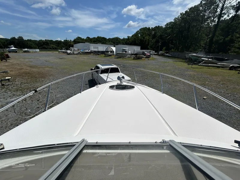 Slide: The Image of 2017 Regal 26 Express boat on trailer in outdoor storage area. - 32