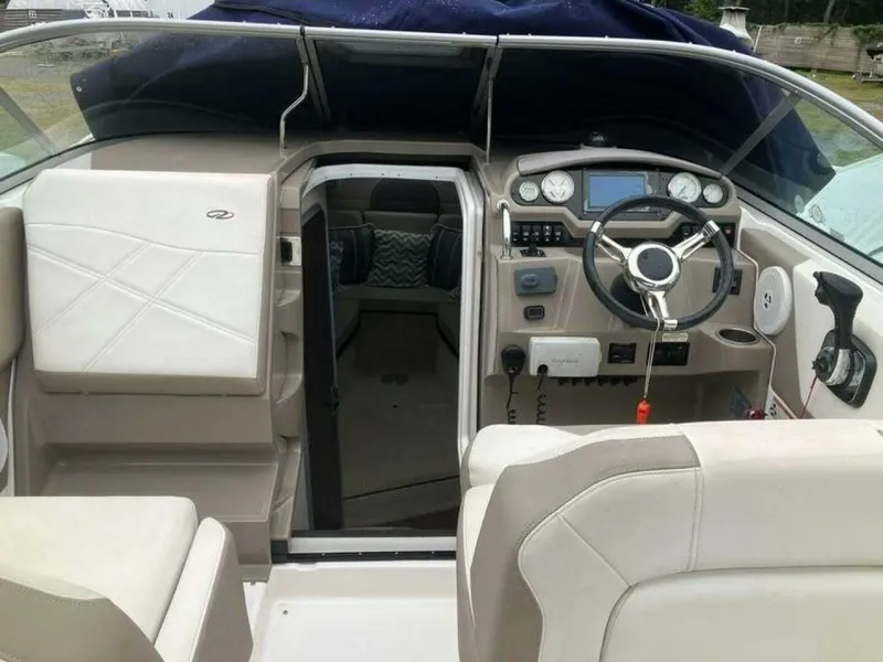 Slide: The Image of 2017 Regal 26 Express boat interior with steering wheel and dashboard controls. - 37