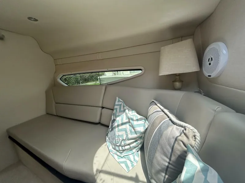 Slide: The Image of Interior of 2017 Regal 26 Express boat with cozy seating and decorative pillows. - 42