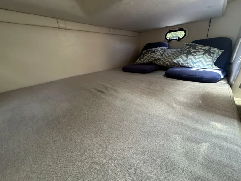 Slide: The Image of 2017 Regal 26 Express cabin interior with cushions and window. - 43