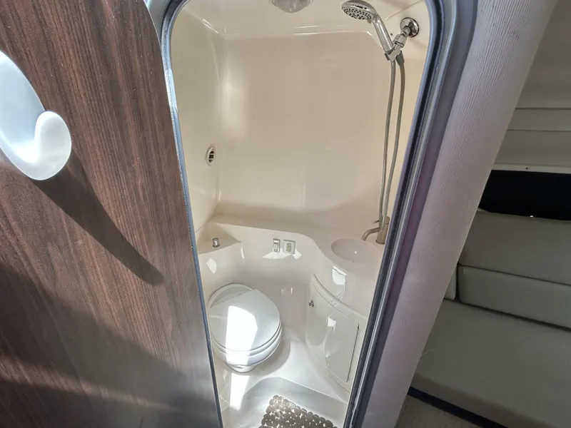 Slide: The Image of 2017 Regal 26 Express boat bathroom with shower and toilet. - 45